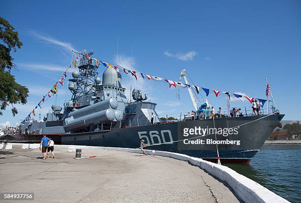 Visitors stand aboard the Zyb 560 fast attack guided missile Baltic Fleet warship during Russian Navy day at the Vistula lagoon in Baltiysk, Russia,...