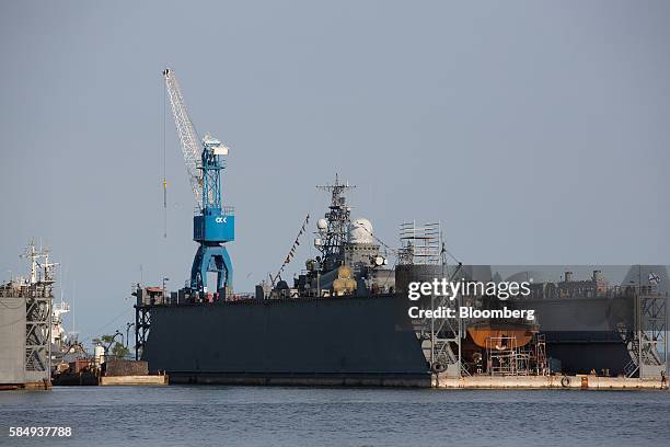 Russian naval warship sits in a floating dry dock during repairs at the Vistula lagoon in Baltiysk, Russia, on Sunday, July 31, 2016. Amid Russia's...