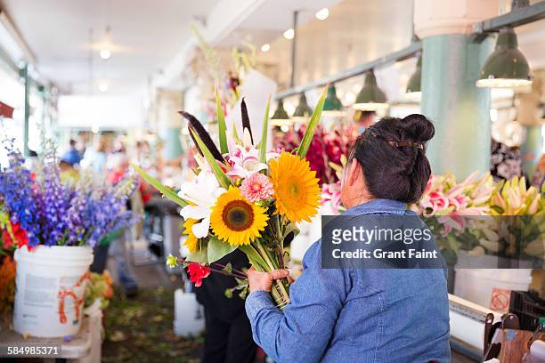 view of market - flower stall stock pictures, royalty-free photos & images