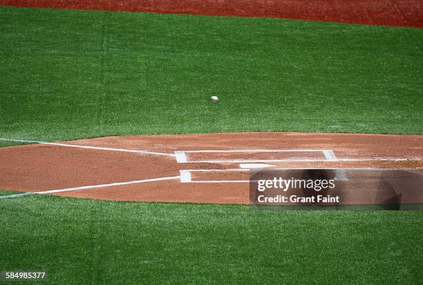 baseball passing home plate - home base ストックフォトと画像