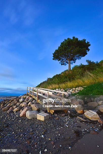 wooden stairs at night - jenco stockfoto's en -beelden