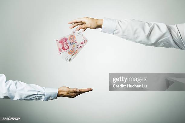 businessman's hand holding money - white shirt stock pictures, royalty-free photos & images