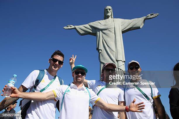 Blake Govers, Matthew Swann, Tom Craig and Simon Orchard of the Australian mens hockey team pose in front of Christ the Redeemer at Corcovado...