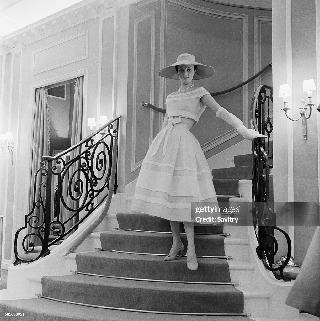 A model wearing a white organdie dress by Dior, Paris, March 1956 ...