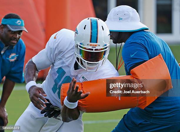 Tyler Murphy of the Miami Dolphins runs a drill during the teams training camp on August 1, 2016 at the Miami Dolphins training facility in Davie,...