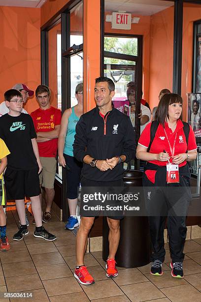 Luis Garcia ambassador of Liverpool is welcomed by fans as he arrives for an appearance at the Kirkwood Dunkin' Donuts on August 1, 2016 in St....