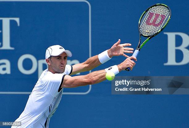 Tim Smyczek of the United States returns a shot to Thiago Montiero of Brazil during the BB&T Atlanta Open at Atlantic Station on August 1, 2016 in...