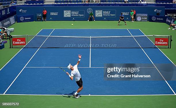 Tim Smyczek of the United States serves to Thiago Montiero of Brazil during the BB&T Atlanta Open at Atlantic Station on August 1, 2016 in Atlanta,...