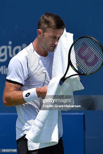 Tim Smyczek of the United States wipes away sweat in his match against Thiago Montiero of Brazil during the BB&T Atlanta Open at Atlantic Station on...