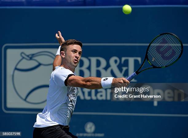 Tim Smyczek of the United States returns a shot to Thiago Montiero of Brazil during the BB&T Atlanta Open at Atlantic Station on August 1, 2016 in...