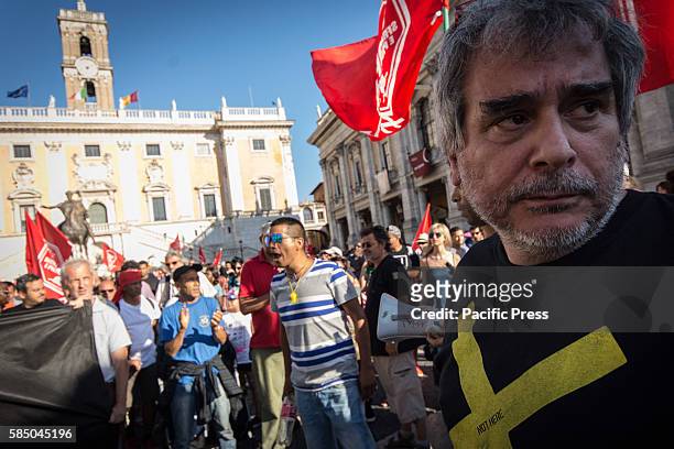 Paolo Di Vetta leader of movement for the right to housing. Protesters of the Movements for the right to protest in the square of the Capitol. After...