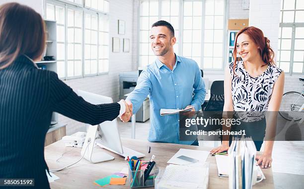 umgang im büro - handshaking in a bank stock-fotos und bilder