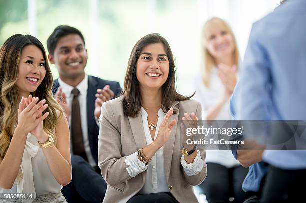 clapping at the end of a presentation - clapping hands office stock pictures, royalty-free photos & images