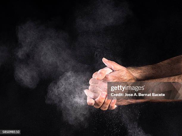 dirty hands of a man, covered with dust, slapping - pets stockfoto's en -beelden