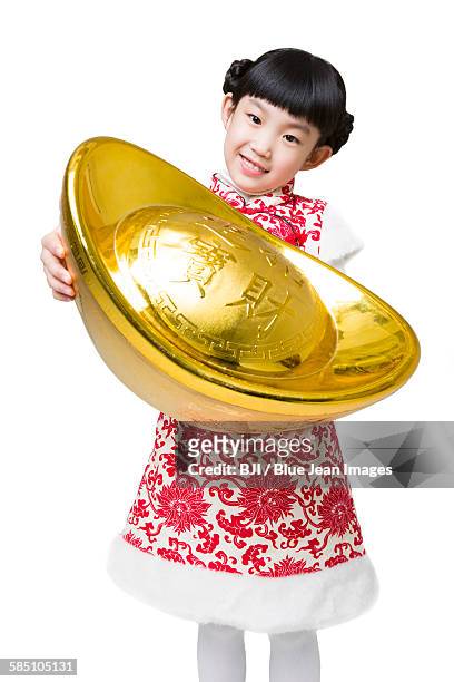 happy girl holding a large chinese traditional currency yuanbao - hoofd schuin stockfoto's en -beelden