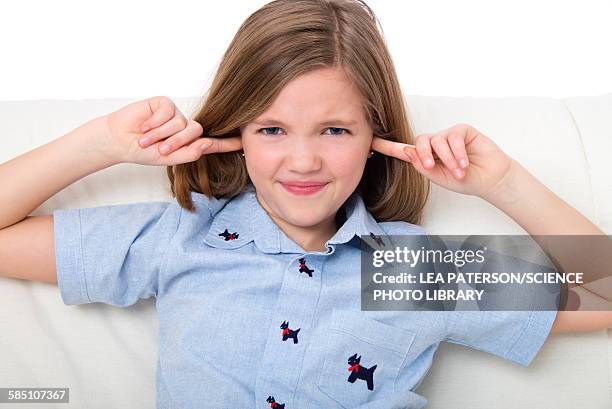 girl with her fingers in ears - woman fingers in ears stock pictures, royalty-free photos & images