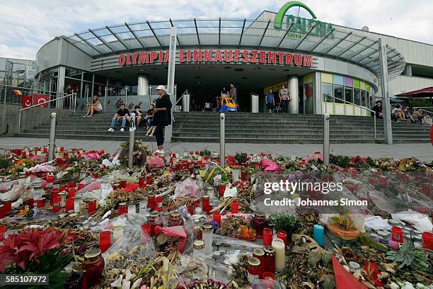 With flowers, candles and personal messages people express their grief for the victims of last weeks shooting spree that left nine victims dead on...