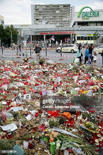 With flowers, candles and personal messages people express their grief for the victims of last weeks shooting spree that left nine victims dead on...