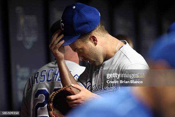 Pitcher Danny Duffy of the Kansas City Royals makes his way into the dugout after striking out Steven Souza Jr. Of the Tampa Bay Rays to end the...