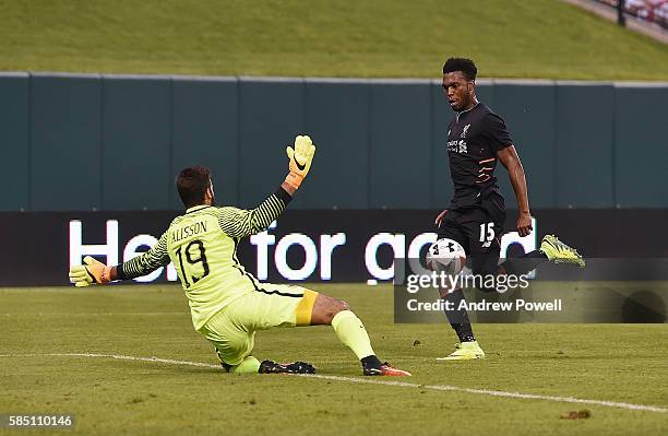 Of Liverpool tries to chip Alisson Becker of AS Roma during the friendly match between AS Roma and Liverpool and at Busch Stadium on August 1, 2016...