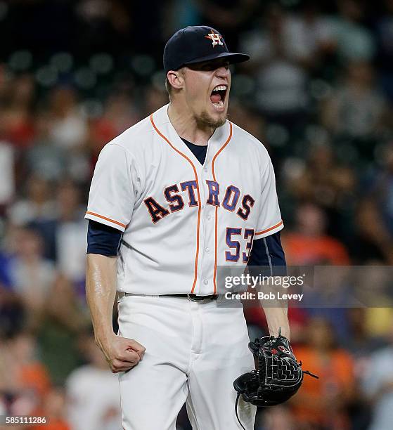 Ken Giles of the Houston Astros reacts after striking out Michael Saunders of the Toronto Blue Jays in the eighth inning at Minute Maid Park on...