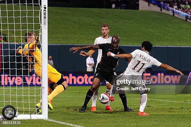 Mohamed Salah of AS Roma scores the game winning goal against Simon Mignolet of Liverpool FC during a friendly match at Busch Stadium on August 1,...