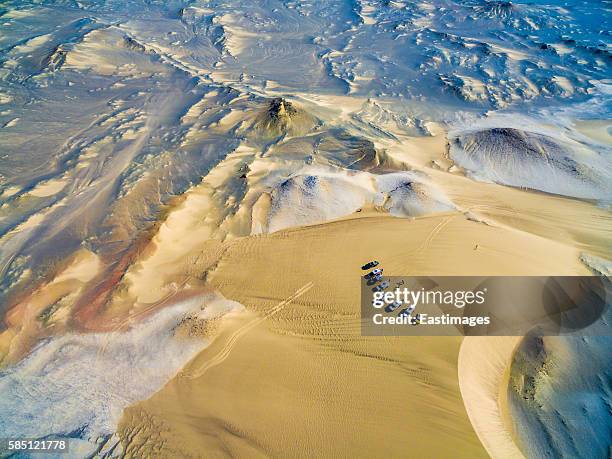 aerial shot of off-road vehicles camping in gobi desert/xinjiang,china. - cars parked in a row stock pictures, royalty-free photos & images