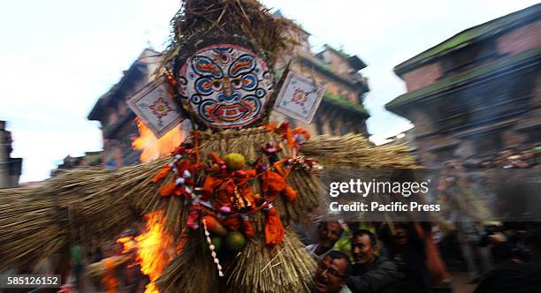 Locals set fire on an effigy of demon during the celebration of Ghantakarna festival in Bhaktapur, Nepal. Ghantakarna festival is celebrated in...