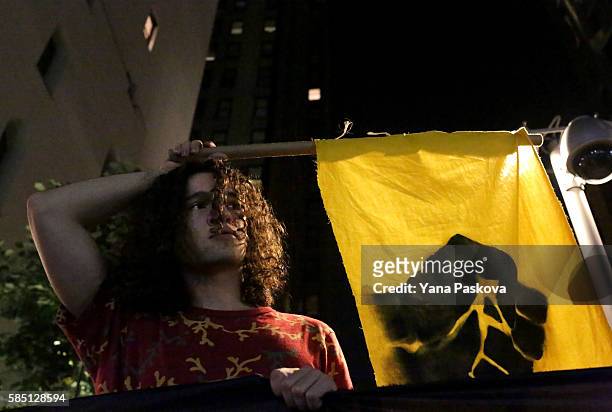 Activists participate in an anti-police brutality protest in City Hall Park in New York City on August 01, 2016. The protest was organized by...