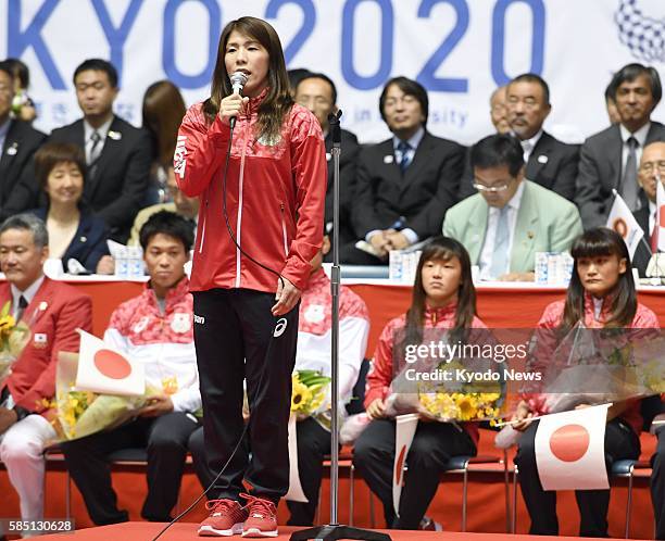 Japanese 53-kilogram class wrestler Saori Yoshida speaks during a pep rally in Tokyo on July 22 to send off the national wrestling team for the Rio...