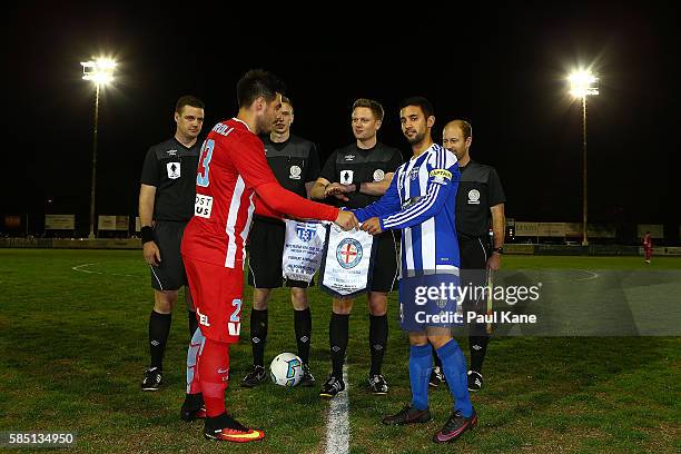 Bruno Fornaroli of Melbourne City and Ludovic Boi of Floreat Athena exchange flags at the coin toss during the FFA Cup Round of 32 match between...