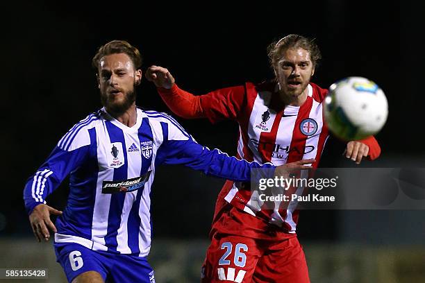 Clayton Arnez of Floreat Athena and Luke Brattan of Melbourne City contest for the ball during the FFA Cup Round of 32 match between Floreat Athena...