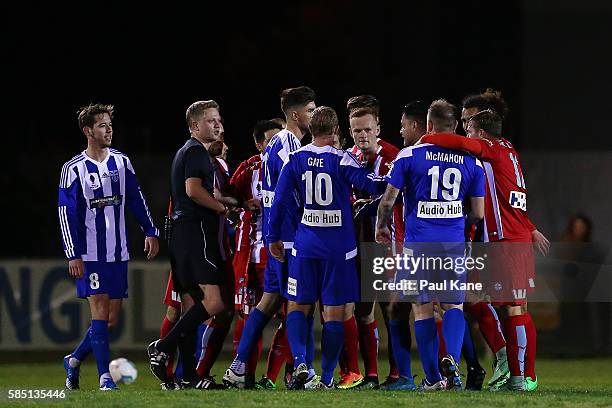 Match Referee Adam Fielding steps as players remonstrate during the FFA Cup Round of 32 match between Floreat Athena and Melbourne City FC at Dorrien...