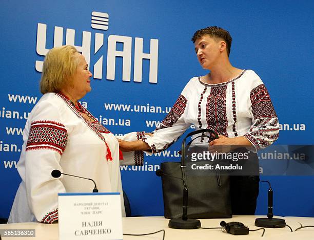Ukrainian pilot, member of the Ukrainian Parliament and member of the Ukrainian delegation to PACE, Nadiya Savchenko speaks with a woman after a...