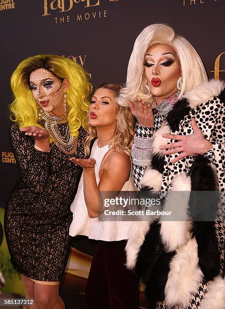 Natalie Bassingthwaighte poses with two drag queens ahead of the Absolutely Fabulous: The Movie Melbourne premiere at Village Cinemas Crown on August...