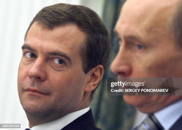 Russian President Vladimir Putin and First Deputy Prime Minister and presidential hopeful Dmitry Medvedev attend a meeting with Hungarian Prime...
