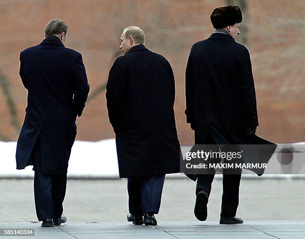 Russian President Vladimir Putin , Russian Defense Minister Igor Ivanov and Director of Federal Security Service Nikolay Patrushev walk after a...