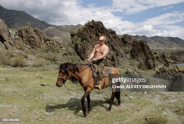 Russian Prime Minister Vladimir Putin rides a horse during his vacation outside the town of Kyzyl in Southern Siberia on August 3, 2009. AFP PHOTO /...