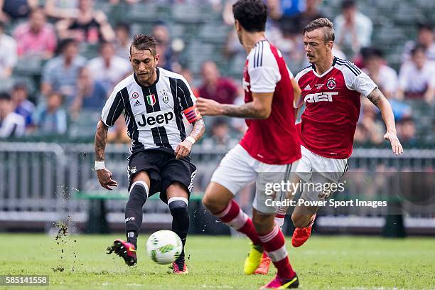 Juventus' player Roberto Pereyra contests the ball against South China's player Griffiths Ryan Alan during the South China vs Juventus match of the...