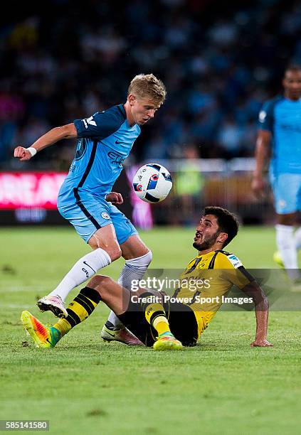 Manchester City striker Alex Zinchenko trips up with Borussia Dortmund midfielder Nuri Sahin during the 2016 International Champions Cup China match...