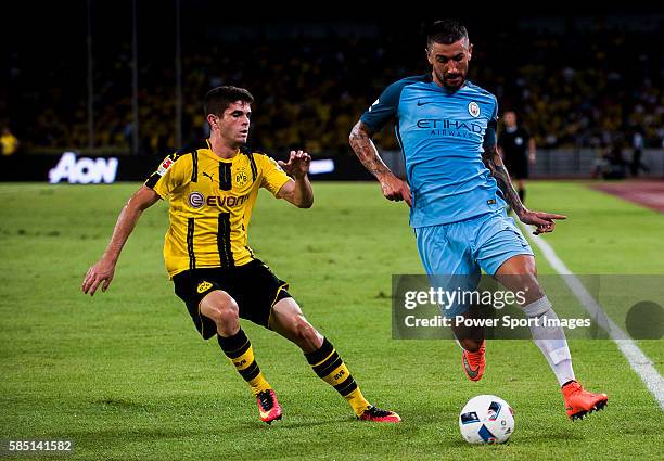 Manchester City defender Aleksandar Kolarov fights for the ball with Borussia Dortmund midfielder Christian Pulisic during the match between Borussia...