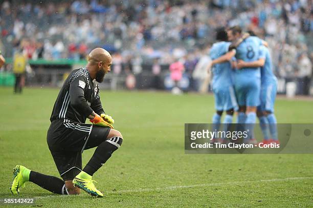 July 30: Goalkeeper Tim Howard of Colorado Rapids on his knees after conceding another goal from Frank Lampard of New York City FC during his sides...