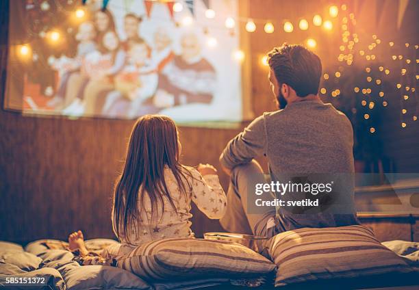 father and daughter day. - movie night stock pictures, royalty-free photos & images