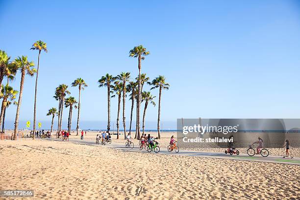 riding bikes in santa monica beach, california - la waterfront stock pictures, royalty-free photos & images