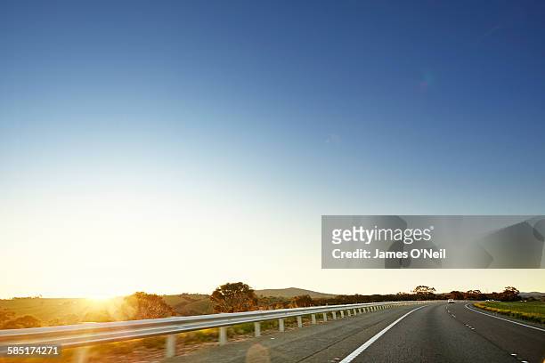 open road in australia - clear sky stock-fotos und bilder