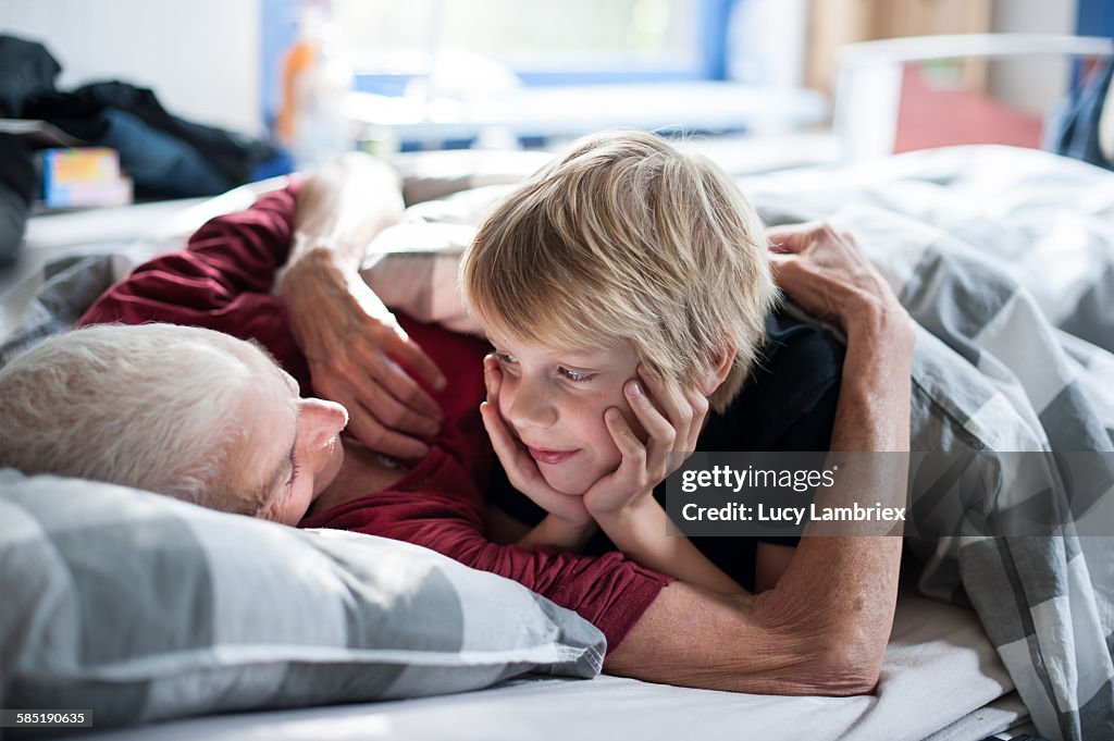 Young boy looking at his grandmother