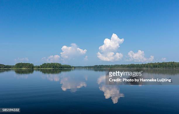 cumulus reflections at a finnish lake - lake finland bildbanksfoton och bilder