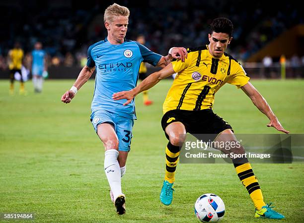 Manchester City striker Alex Zinchenko fights for the ball with Borussia Dortmund defender Marc Bartra during the 2016 International Champions Cup...