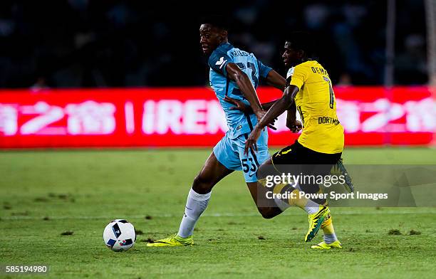 Borussia Dortmund striker Ousmane Dembele plays against Manchester City Tosin Adarabioyo during the match between Manchester City FC during their...