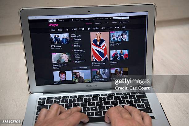 In this photo illustration, the BBC iPlayer app is displayed on a laptop screen as hands touch its keyboard on August 2, 2016 in London, England. The...